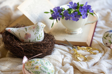 Easter 2025 table decoration for the holiday with flowers and accessories.