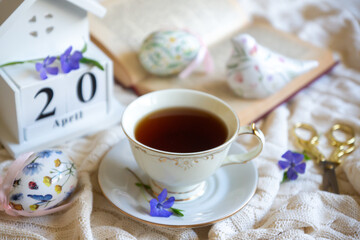 Easter 2025 table decoration for the holiday with flowers and accessories.