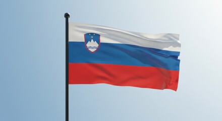 Obraz premium Slovenian Flag Waving Proudly Under a Clear Blue Sky A Symbol of National Identity and Sovereignty
