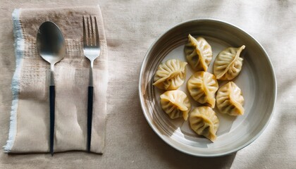 Freshly steamed momos served with spicy chutney. A popular Asian street food and delicious dumpling snack from Tibetan, Nepali, and Indian cuisines.