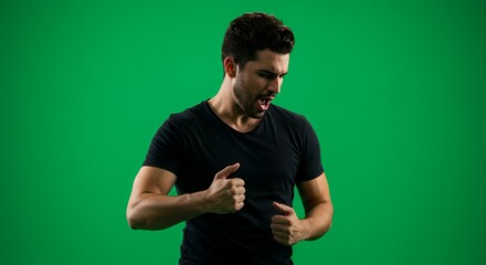 Man in Black T-Shirt Gesturing Against Green Screen