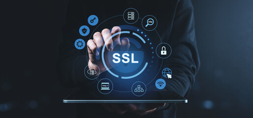 Fototapeta premium SSL security interface with icons on virtual screen over tablet in dark setting.