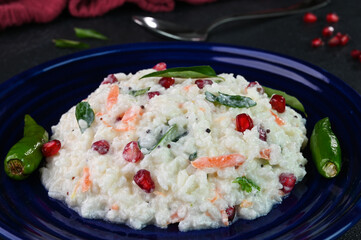 Curd rice served in a plate.