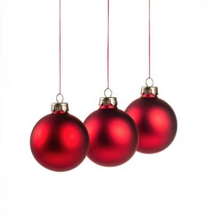 Three hanging red Christmas ornaments isolated on a white background,
