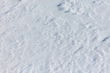 The snow is white and the ground is covered in it