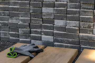 Gray granite cubes stacked in the garden, preparation for laying cubes on the veranda in garden