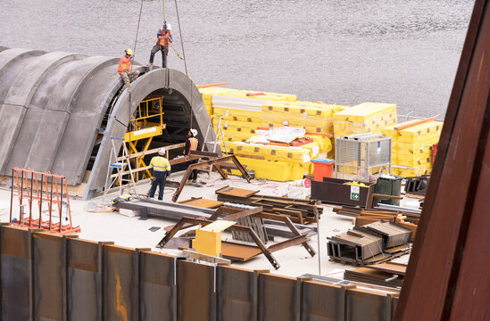 Construction of a building extension on the side of a river