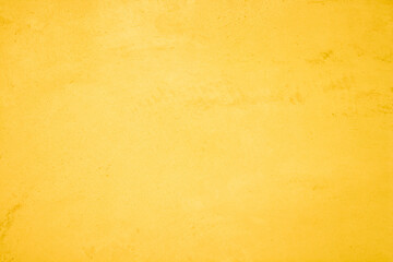 Yellow concrete stone texture for background in summer wallpaper. Cement and sand wall of tone vintage minimal. Concrete abstract wall of light yellow color, cement texture white blank for home decor.