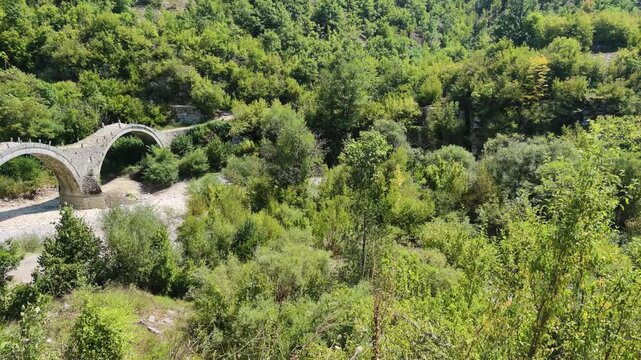 Amazing  view of Medieval Plakidas (Kalogeriko) Bridge at Pindus Mountains, Zagori, Epirus, Greece
