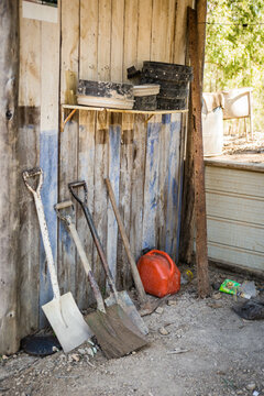 Shovels and fossicking sieves in old wooden shack