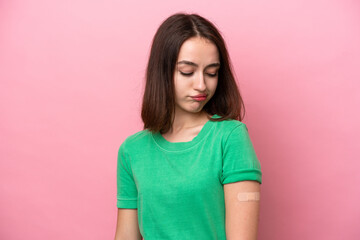 Fototapeta premium Young Ukrainian woman wearing a band aids with sad expression