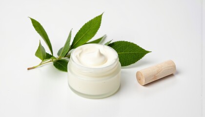 Natural skincare cream with leaves on a white background  