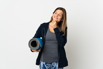 Fototapeta premium Slovak girl going to yoga classes isolated on white background looking to the side and smiling