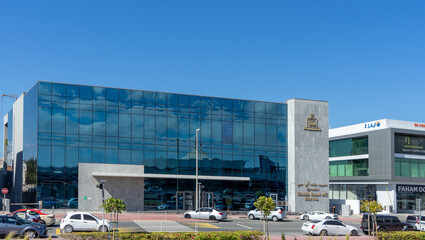 Facade of building of Habib Bank AG Zurich in Dubai, United Arab Emirates. Street and road in Dubai city