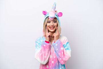 Young Russian woman with unicorn pajamas isolated on white background smiling with a happy and...