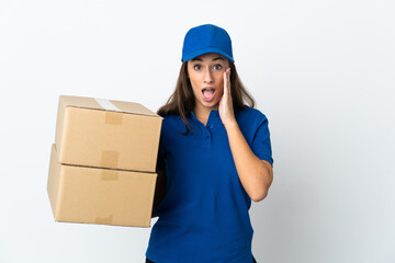 Young delivery woman over isolated white background with surprise and shocked facial expression