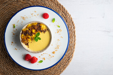 Mango pudding with chocolate and fresh fruit. Top view table.