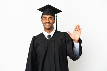 African American university graduate man over isolated white background saluting with hand with...