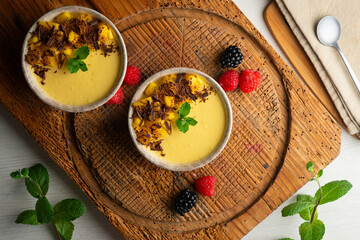 Mango pudding with chocolate and fresh fruit.