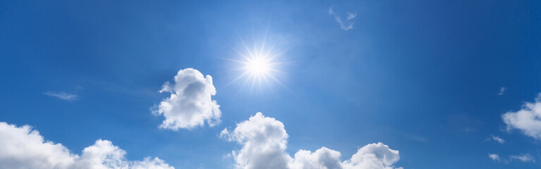  Bright Sun in a Clear Blue Sky with Scattered Clouds