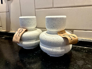 Two white, original, designer vases on black table. Wonderful gift for housewarming or other...