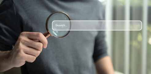 Search data and SEO technology, Hand holding magnifying glass searching for information on the website. Online networking system, Using Search Console with website