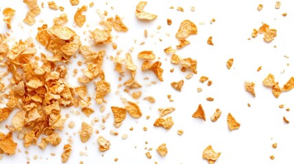 Crispy cereal flakes scattered on white background
