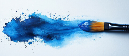 Abstract blue paint stroke with paintbrush.