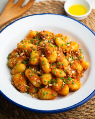 Dish of Italian gnocchi with tomato and meat Bolognese sauce. Top view table.