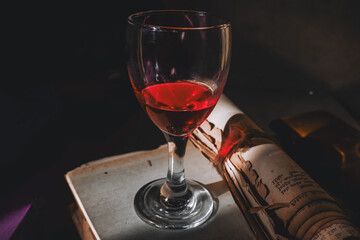 Vintage Books and Red Drink Glass in Natural Light
