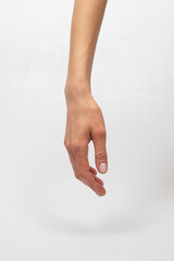 A Close-Up of a Hand and Arm Against a White Backdrop