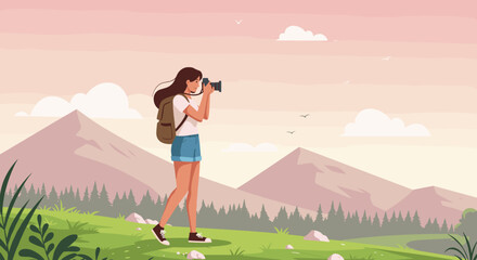 Obraz premium Young woman taking photographs in a serene mountain landscape 