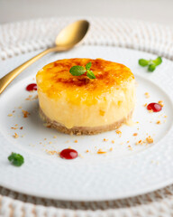 Burnt Catalan custard tart with a biscuit base. Top view of a table.