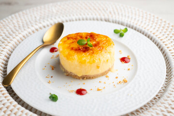 Burnt Catalan custard tart with a biscuit base. Top view of a table.