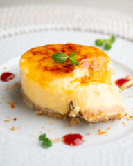 Burnt Catalan custard tart with a biscuit base. Top view of a table.