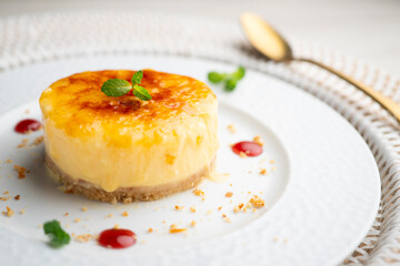 Burnt Catalan custard tart with a biscuit base. Top view of a table.