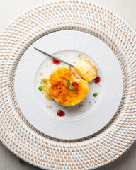 Burnt Catalan custard tart with a biscuit base. Top view of a table.