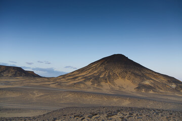Sunset lights on the black desert in Egypt