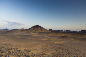 Sunset lights on the black desert in Egypt