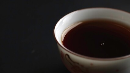 An Elegant Tea Pouring Gracefully into a Beautiful Traditional Cup Ready for Enjoyment. Media