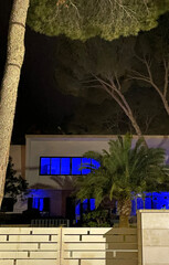 Night shot. Unusual house with blue windows. Mallorca island. Spain