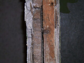 Close-up view of textured wood grain revealing age and natural wear in a rustic setting