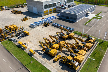Solar powered construction machinery distribution and service center. Aerial view