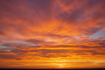 Fototapeta premium colorful sunset sky with clouds in the background