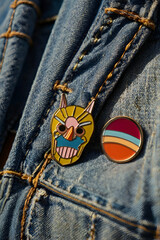 Colorful enamel pins on denim jacket mockup