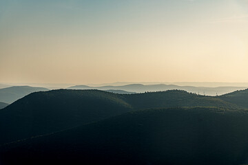 beautiful background of blazing sunrise in mountains golden hour