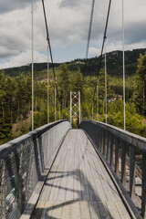 Old wooden bridge across the Hallingdalselva river flowing into Lake Kroderen in Norway, Scandinavia