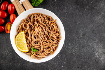 Buckwheat noodles soba in a bowl fresh dish Asian cuisine on the table rustic food top view copy space