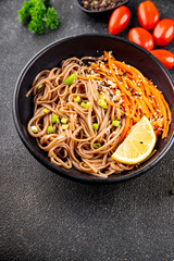 Buckwheat noodles soba in a bowl fresh dish Asian cuisine on the table rustic food top view copy space