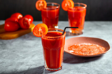Three refreshing vegetable cocktail. Tomato juice served in glass with tomato slice. Image for menu, bars, restaurants